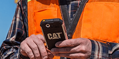 Person in safety vest using phone