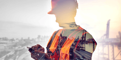Silhouette of worker with city backdrop