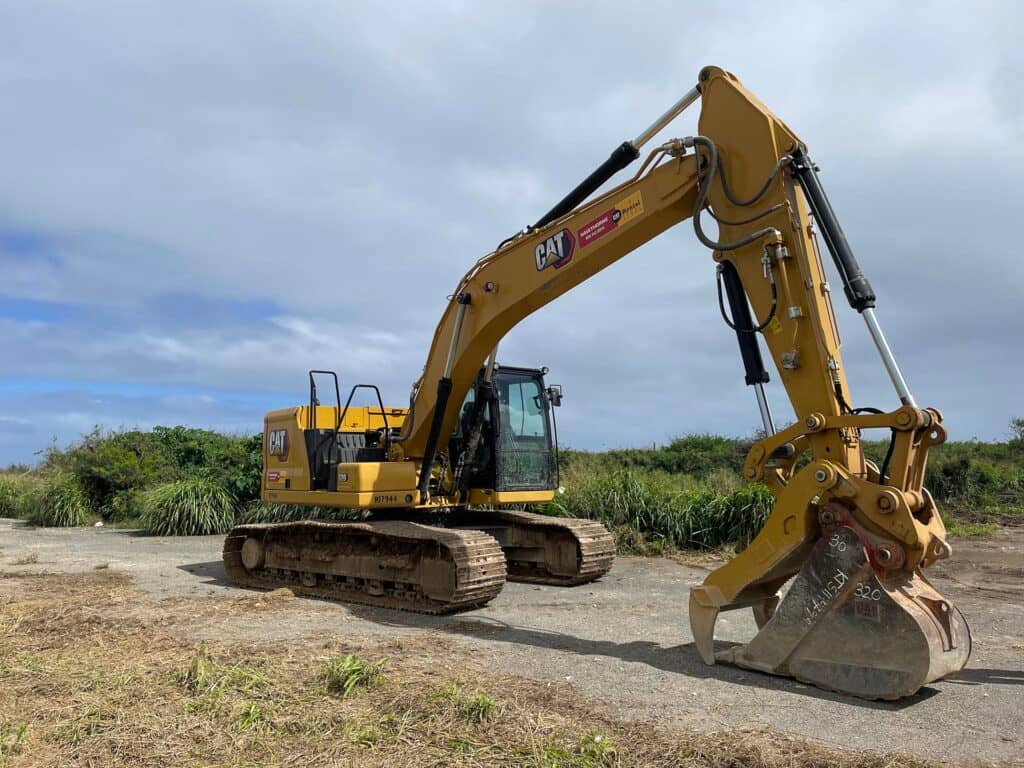 Yellow excavator on construction site